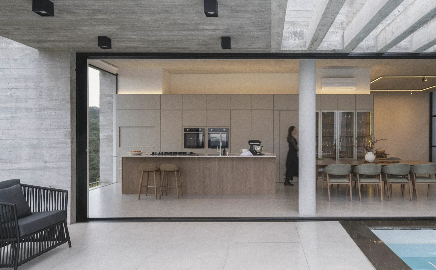 The house open to the terrace and the hills