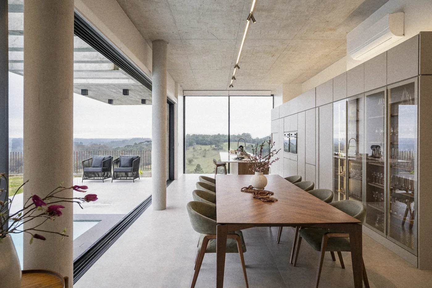 The long walnut table and the terrace