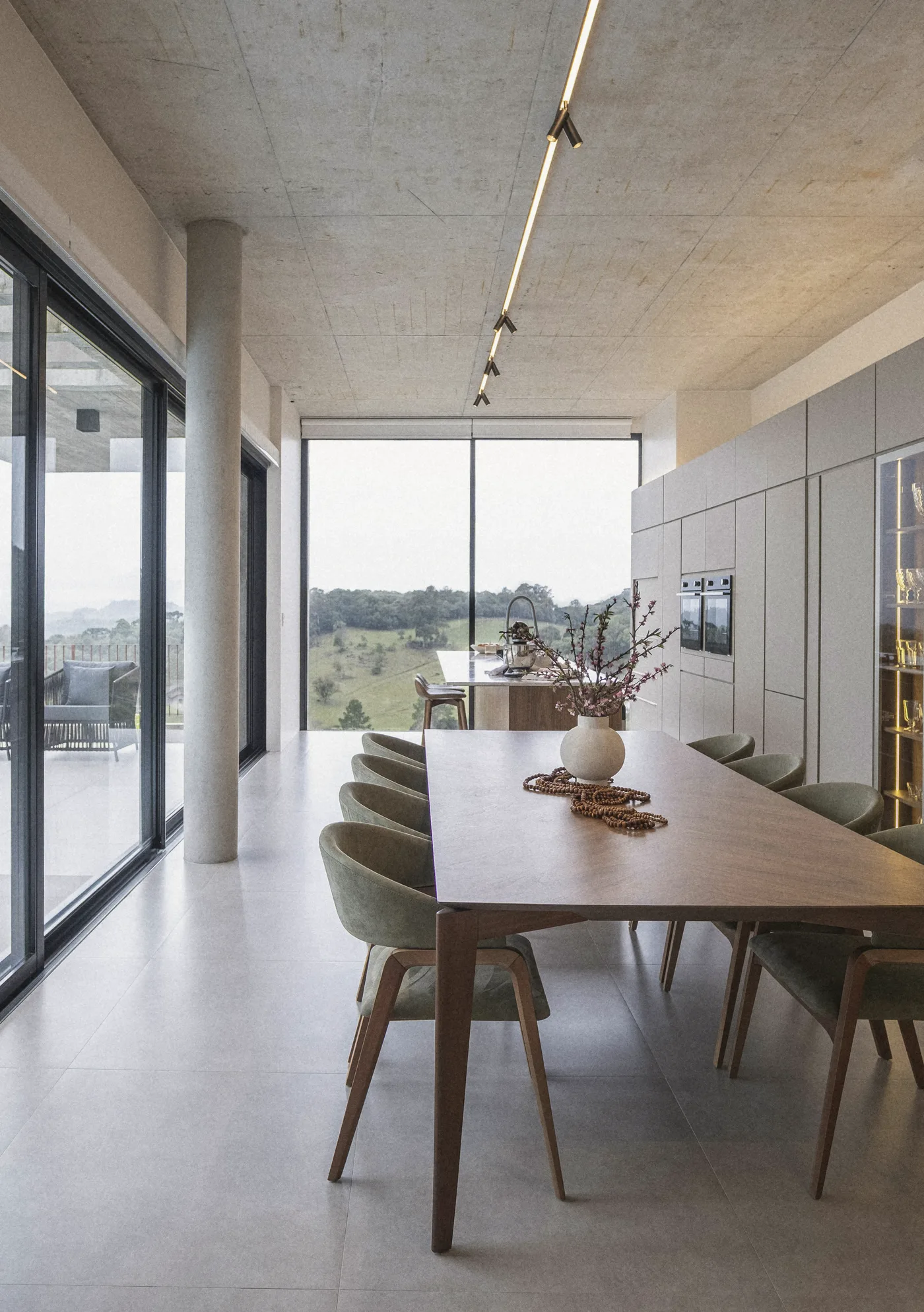 The long table between the glass and the column
